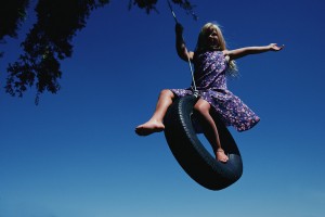 Girl Swinging on Tire